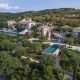 luxury villas - drone shot of imposing villa with two pools at the sea