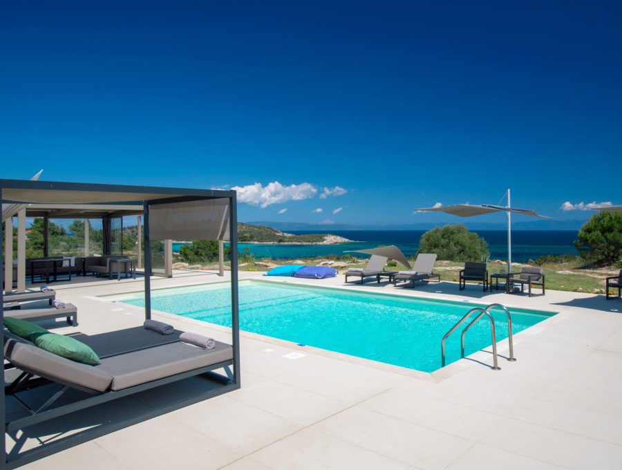 luxury villas - pool with sun beds