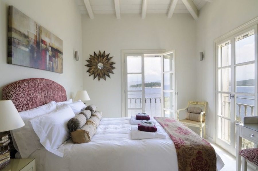 luxury villas - bedroom with double bed with balcony and sea view