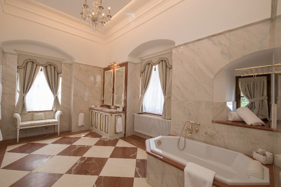 luxury villas - large bathroom with bath tub with marble tiles