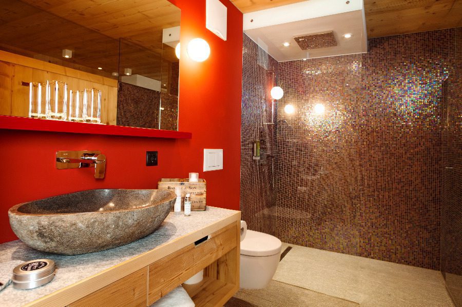 luxury villas - bathroom with stone sink and mosaic wall