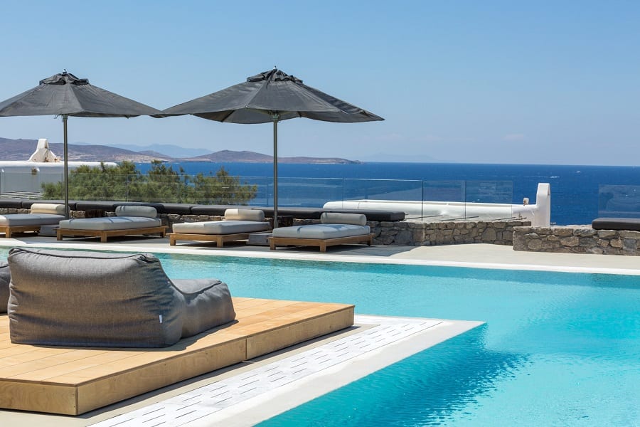 luxury villas - large pool with sun beds and sea view