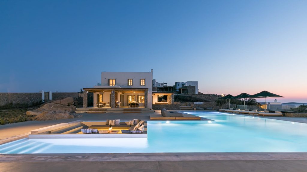 luxury villas - large pool with villa by night