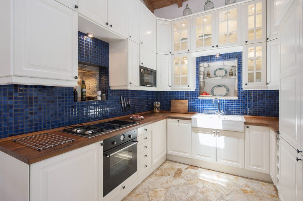 luxury villas - cosy kitchen with blue mosaic tiles