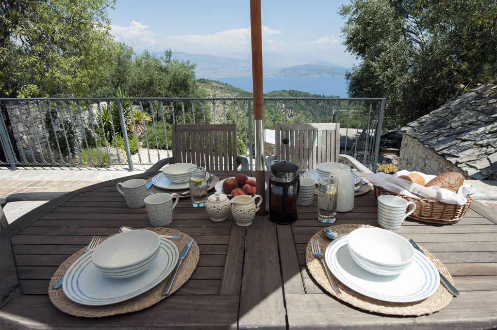 luxury villas - set up breakfast table outside with sea view