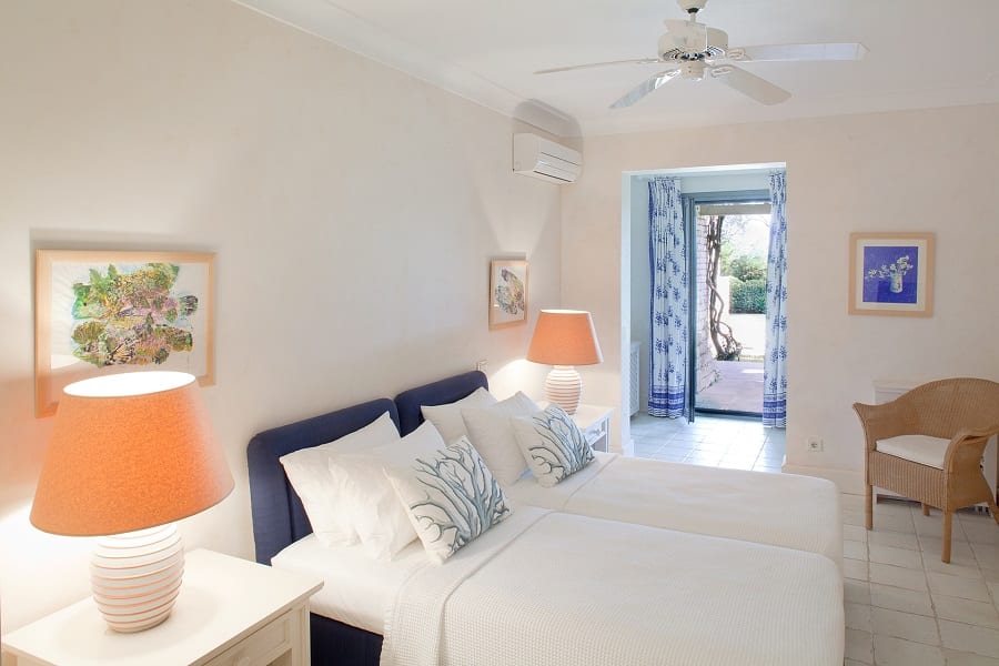 luxury villas - bedroom with two single beds and view on the terrace