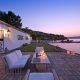 luxury villas - patio with relaxing area at the sea in the sunset