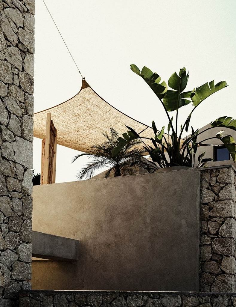luxury villas - outside patio with plants and sun sail