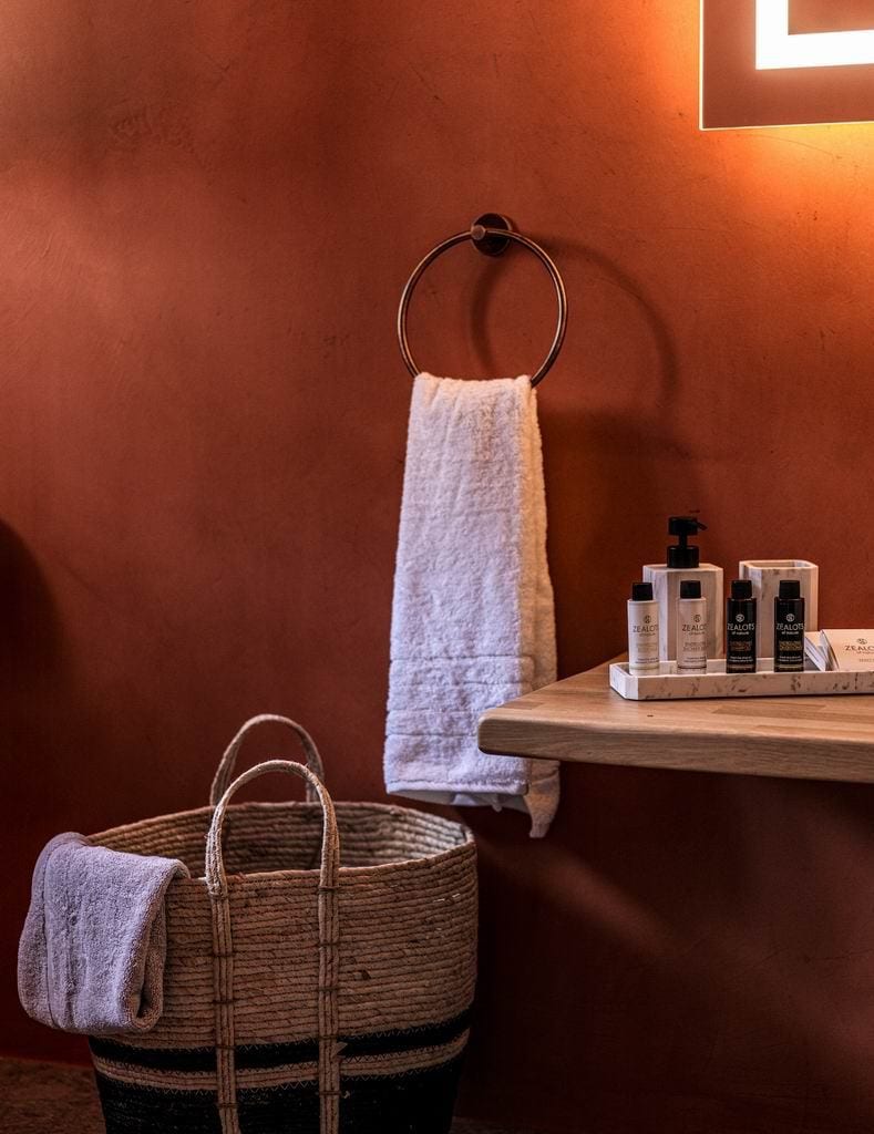 luxury villas - orange wall in bathroom with towel