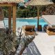 luxury villas - pool and sun beds with outside dining area