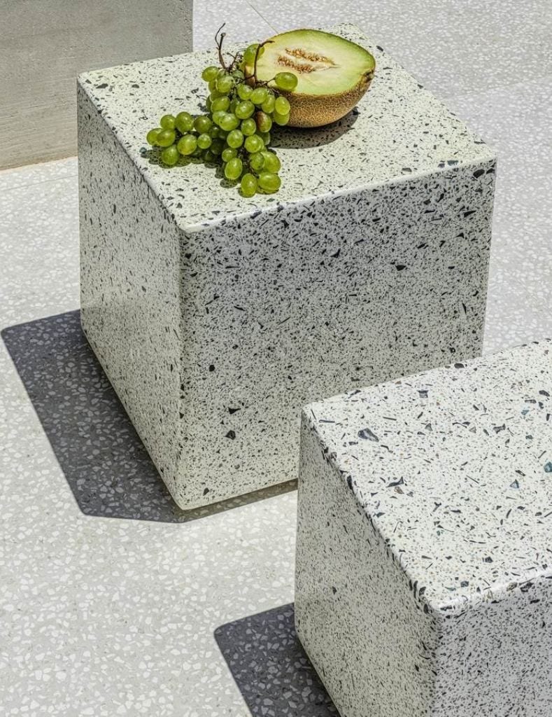 luxury villas - melon and grapes on a stone cube