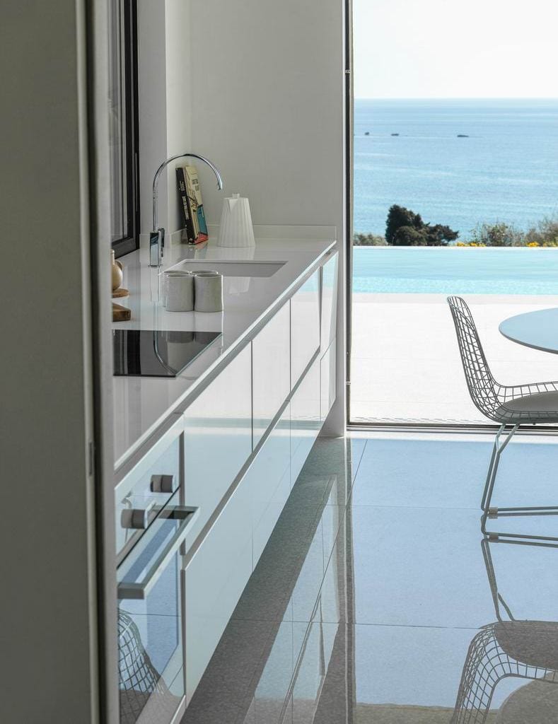 luxury villas - white kitchen with pool and sea view