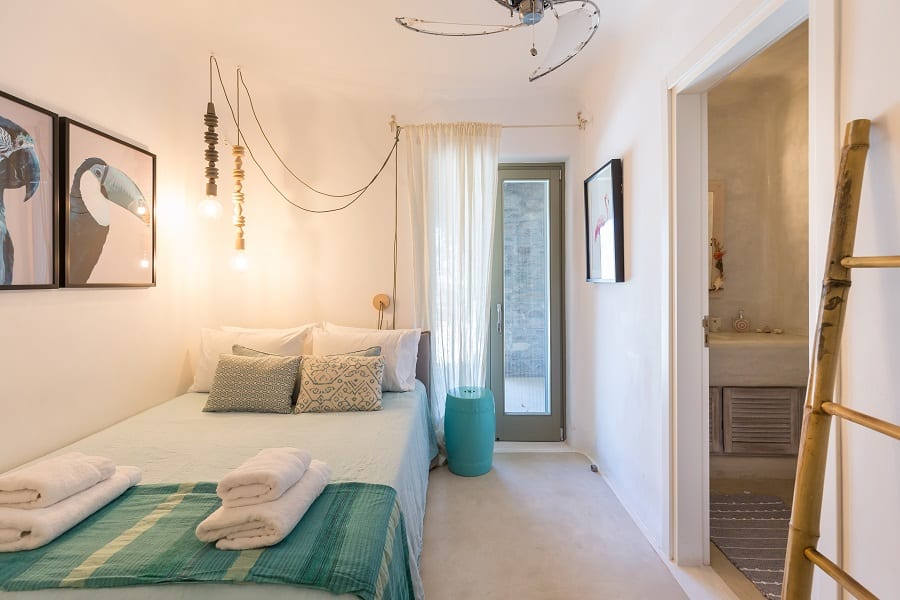 luxury villas - bedroom with bed and bathroom