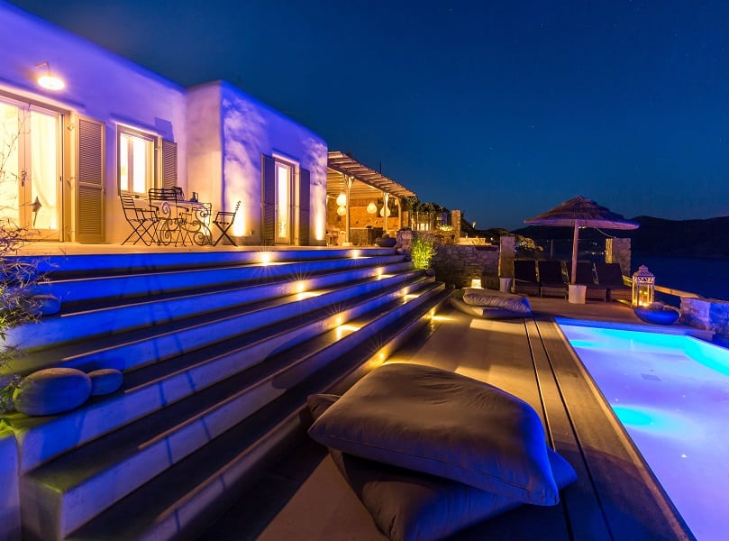 luxury villas - outside patio with pool by night